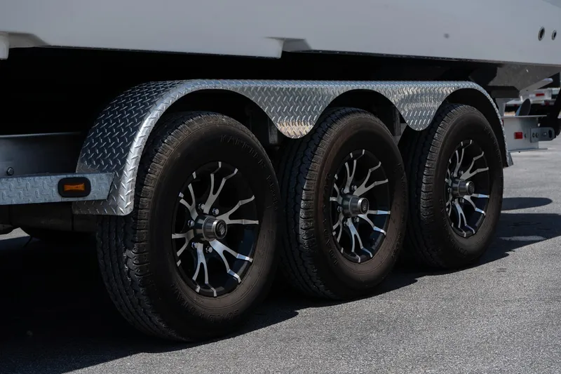 Slide: The Image of Triple-axle trailer with black alloy wheels for 2023 Sunsation 32 CCX boat. - 7