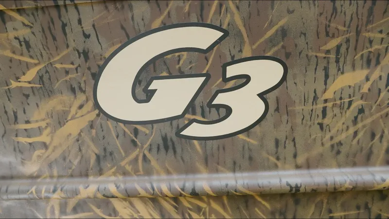 Slide: The Image of Camouflage-patterned G3 18CC boat logo, 2025 model. - 13