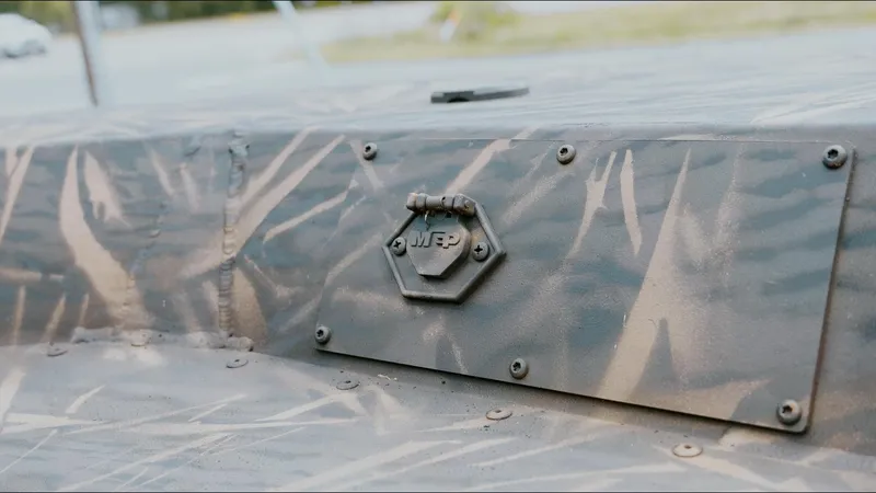 Slide: The Image of Camouflage pattern on 2025 G3 18CC boat with metal hatch detail. - 15