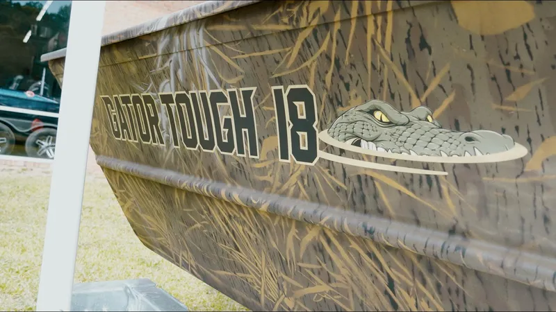 Slide: The Image of G3 18CC 2025 boat with "Gator Tough 18" camo design and alligator graphic. - 16