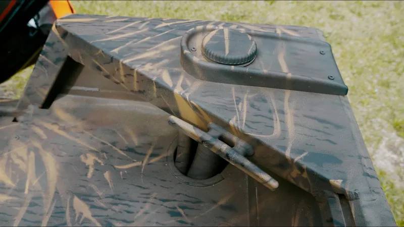 Slide: The Image of Camouflage-patterned detail of a 2025 G3 18CC boat component. - 9