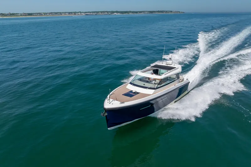 Slide: The Image of 2023 Delta Powerboats 33 Coupe cruising on open water. - 14