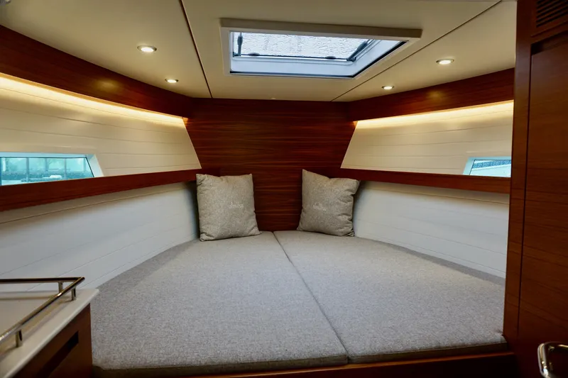 Slide: The Image of 2023 Delta Powerboats 33 Coupe interior cabin with skylight and modern design. - 27