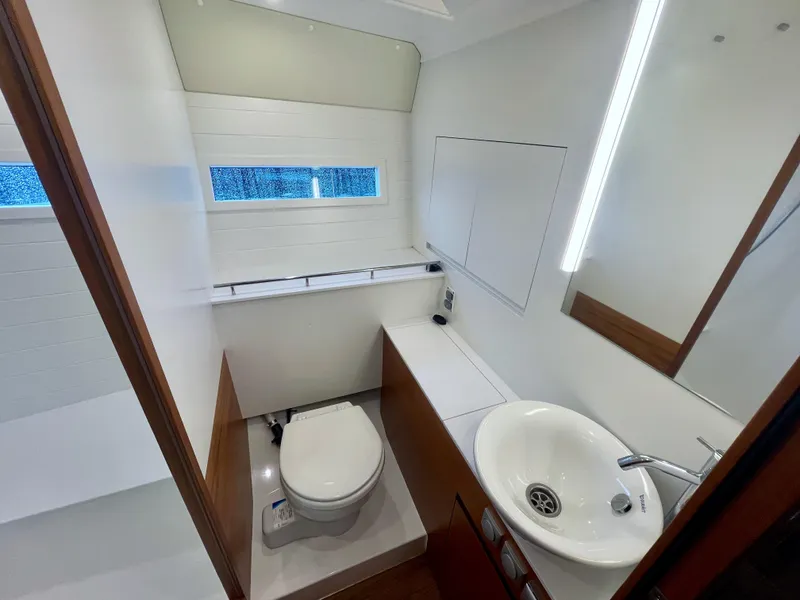 Slide: The Image of Modern bathroom interior of 2023 Delta Powerboats 33 Coupe, featuring sleek design and fixtures. - 30