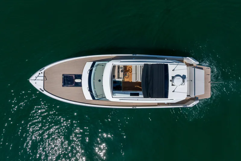 Slide: The Image of Aerial view of 2023 Delta Powerboats 33 Coupe on calm water. - 4