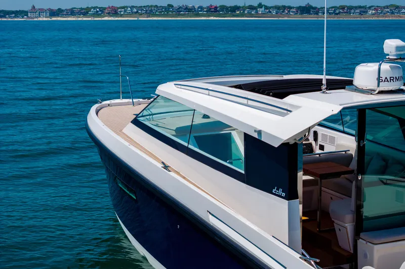 Slide: The Image of 2023 Delta Powerboats 33 Coupe cruising on open water. - 6