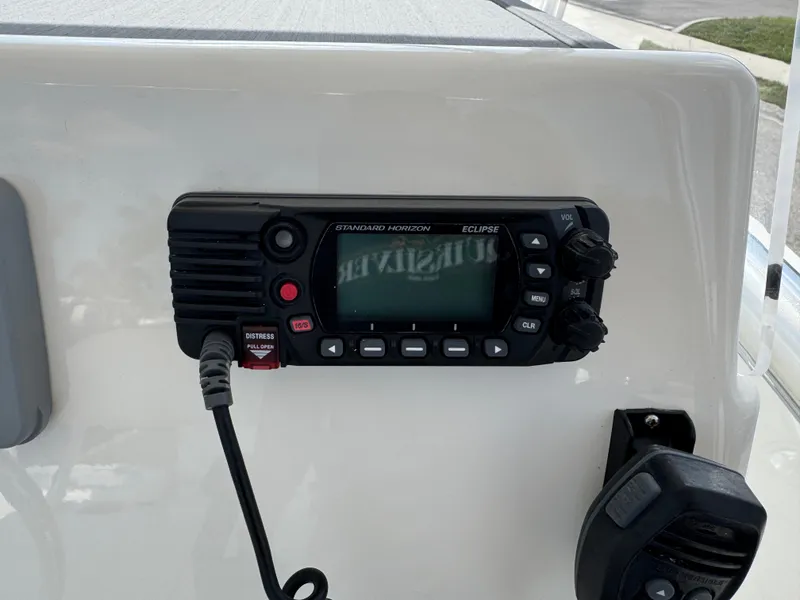 Slide: The Image of VHF radio on 2020 Cobia 220 Center Console boat dashboard. - 18