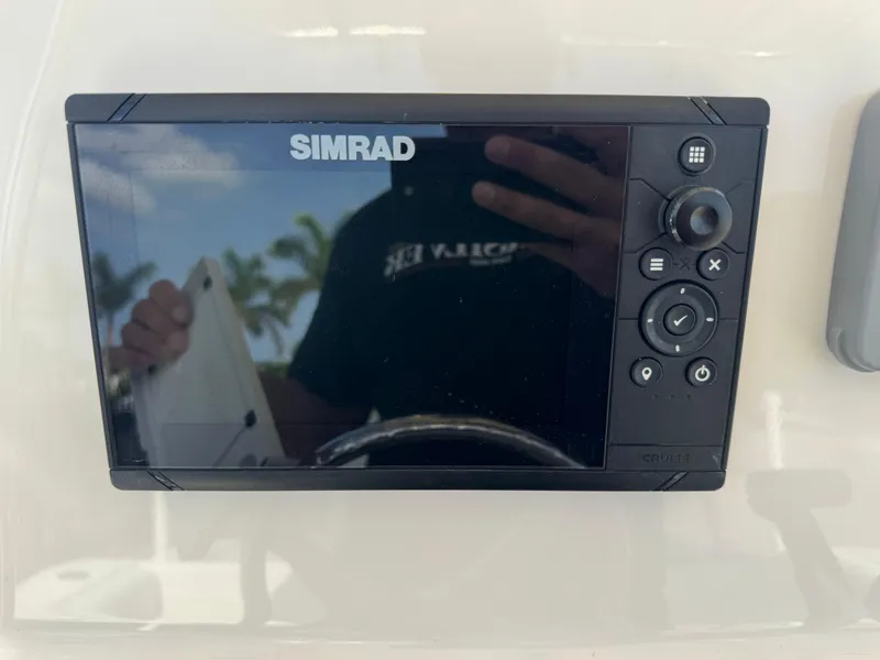 Slide: The Image of Simrad display on 2020 Cobia 220 Center Console boat dashboard. - 22
