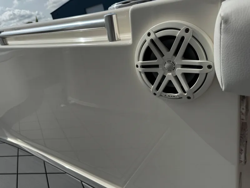 Slide: The Image of 2020 Cobia 220 Center Console boat speaker detail with stainless steel railing. - 24