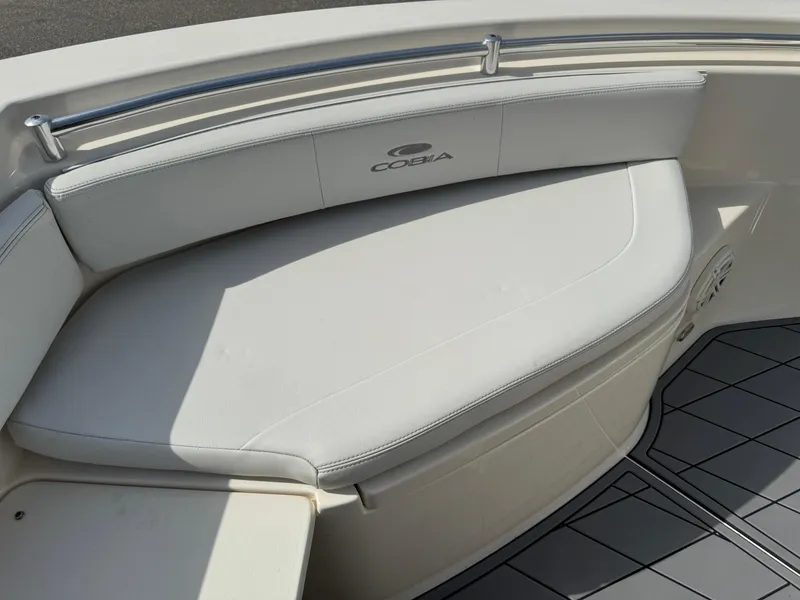 Slide: The Image of 2020 Cobia 220 Center Console boat with cushioned seating and sleek design. - 29