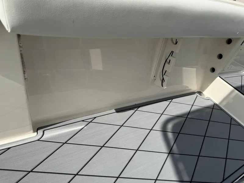 Slide: The Image of 2020 Cobia 220 Center Console boat interior with grid-patterned flooring. - 36