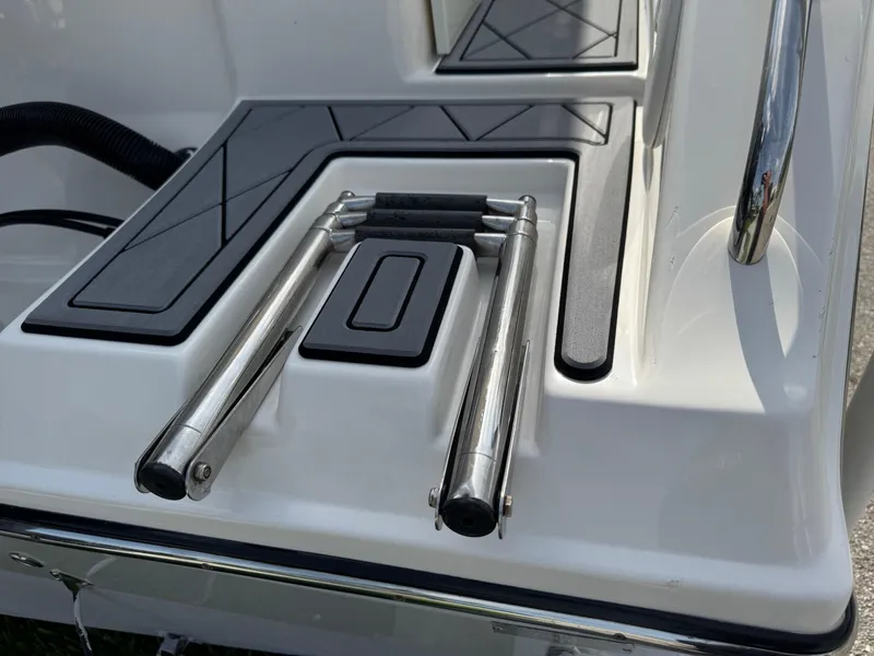 Slide: The Image of 2020 Cobia 220 Center Console boat ladder and deck detail. - 4