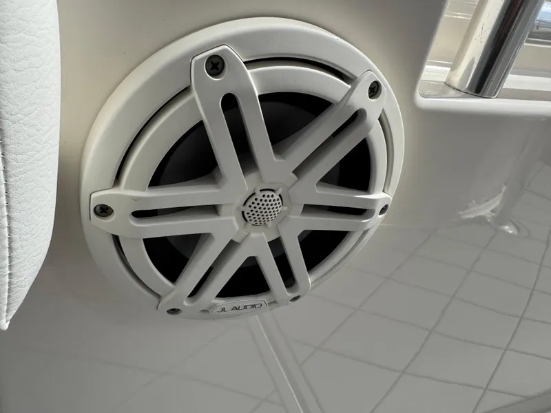 Slide: The Image of Speaker on 2020 Cobia 220 Center Console boat, featuring a sleek white design. - 40