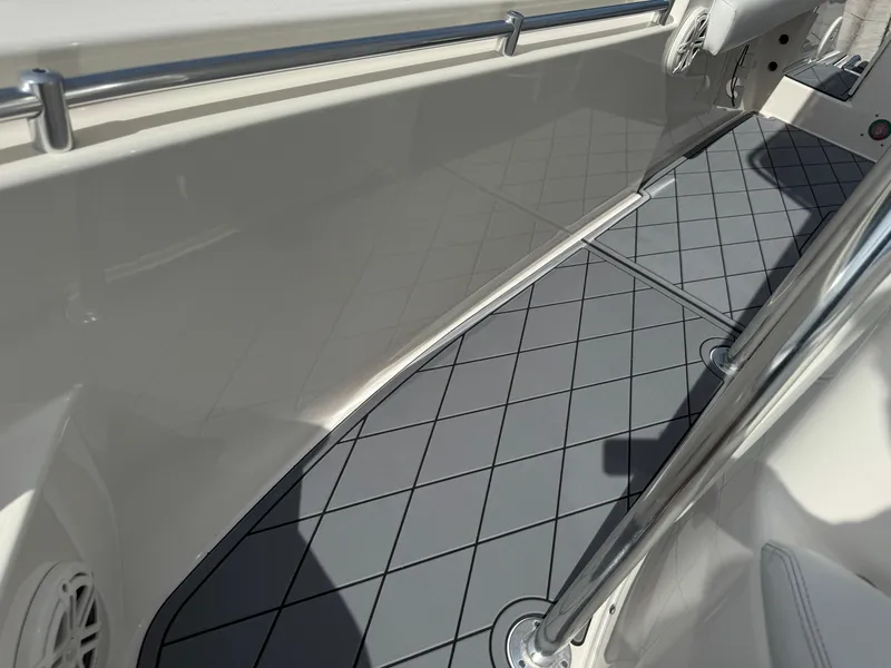 Slide: The Image of 2020 Cobia 220 Center Console boat interior with non-slip flooring. - 45
