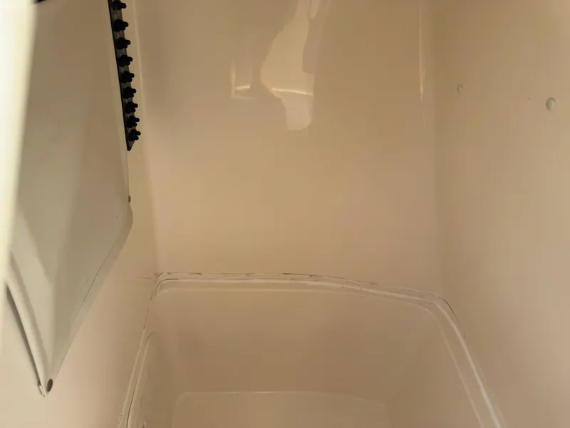 Slide: The Image of Interior view of a 2020 Cobia 220 Center Console boat compartment. - 46