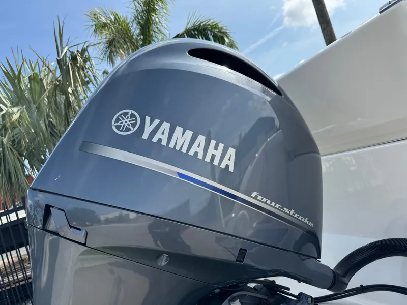 Slide: The Image of Yamaha four-stroke engine on 2020 Cobia 220 Center Console boat, with palm trees in background. - 5