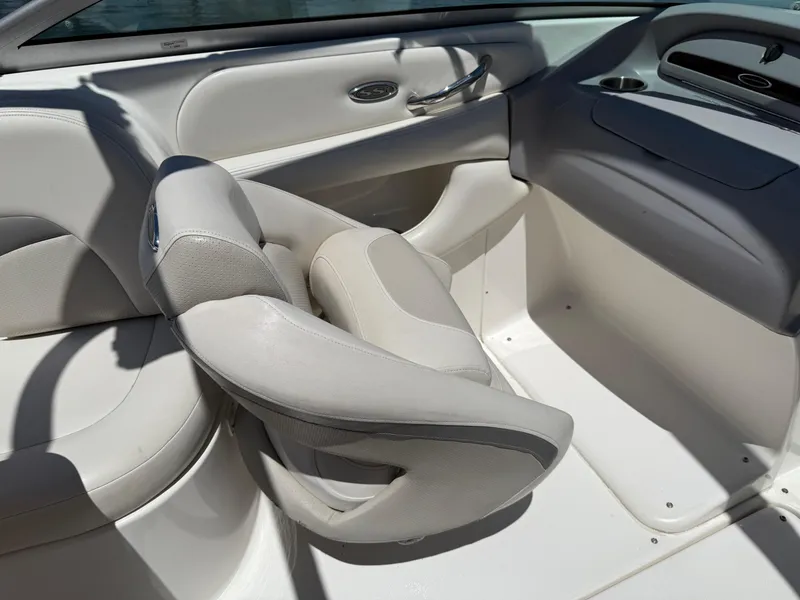 Slide: The Image of 2006 Chaparral 220 SSi boat interior with white and gray seating. - 13