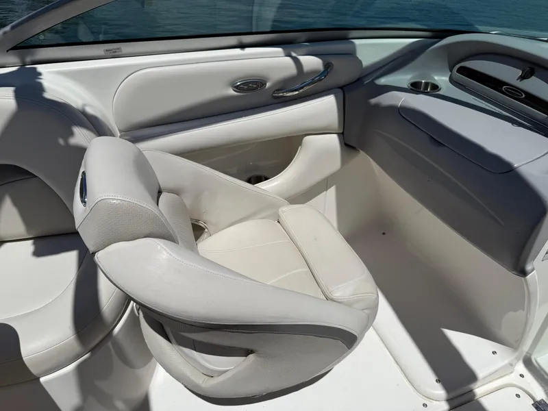 Slide: The Image of 2006 Chaparral 220 SSi boat interior with white seating and sleek design. - 14