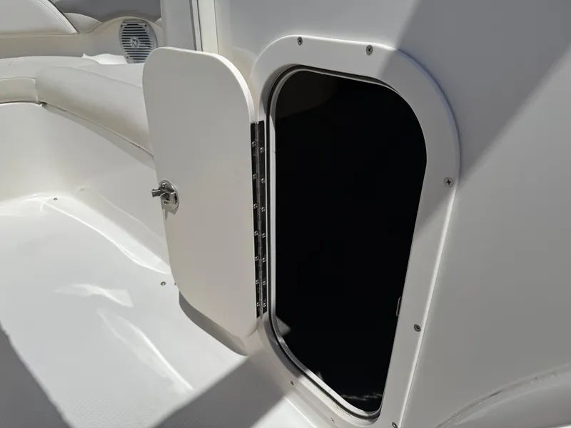 Slide: The Image of Open storage compartment on 2006 Chaparral 220 SSi boat interior. - 26