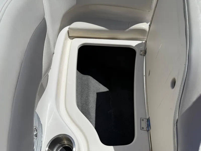Slide: The Image of Storage compartment in a 2006 Chaparral 220 SSi boat interior. - 27