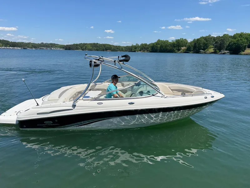 Slide: The Image of 2006 Chaparral 220 SSi boat on a lake under clear blue skies. - 5