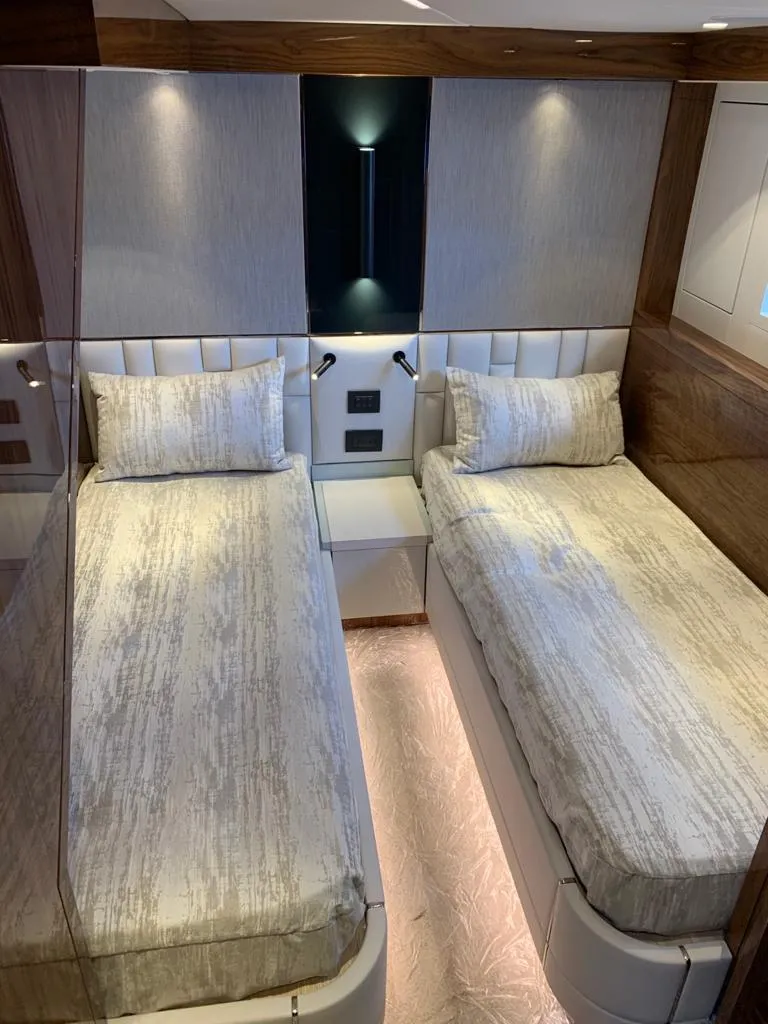 Slide: The Image of Luxurious twin cabin in 2020 Sunseeker Manhattan 68 yacht, featuring modern design and ambient lighting. - 18
