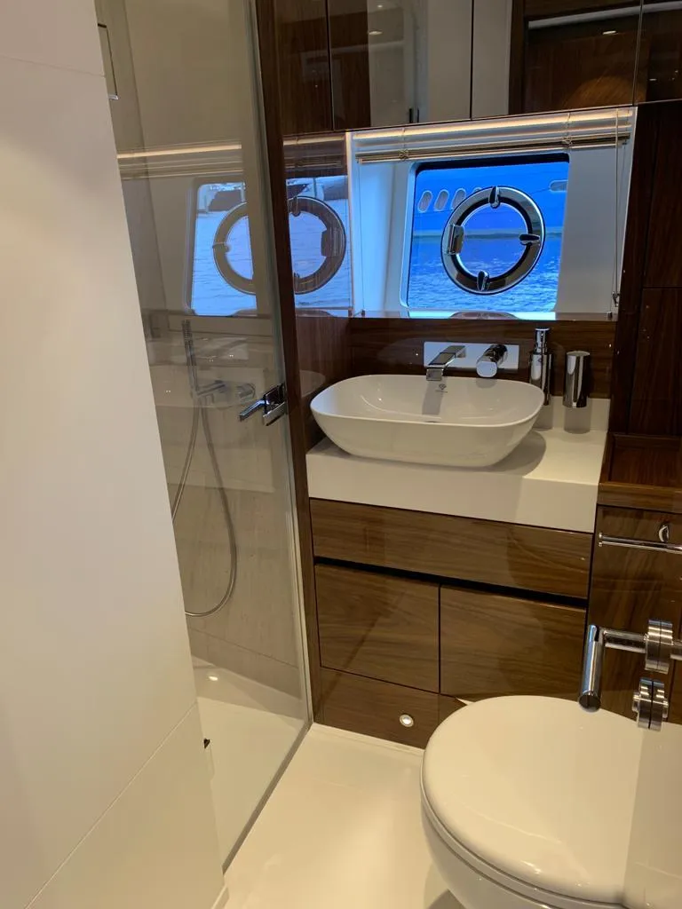 Slide: The Image of Luxurious bathroom in 2020 Sunseeker Manhattan 68 yacht with modern fixtures and ocean view. - 21