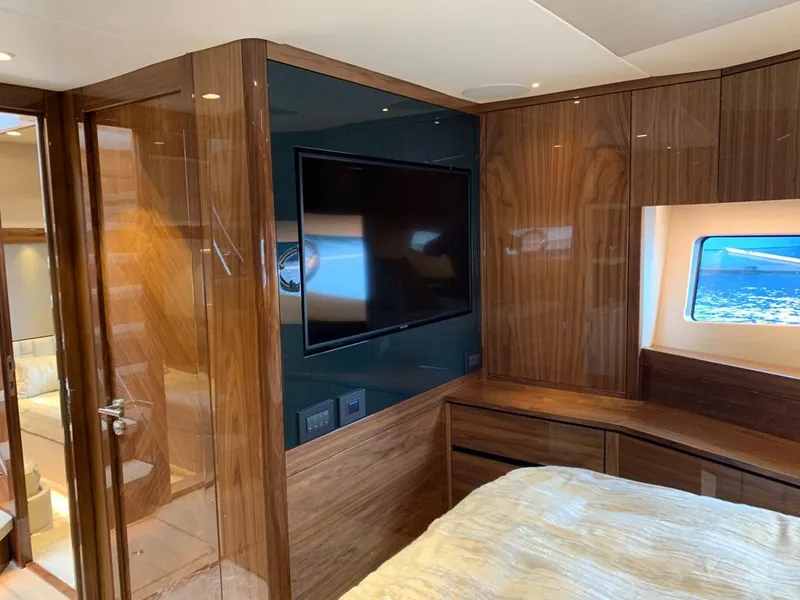 Slide: The Image of Luxurious interior of 2020 Sunseeker Manhattan 68 yacht with wood paneling and large window. - 25