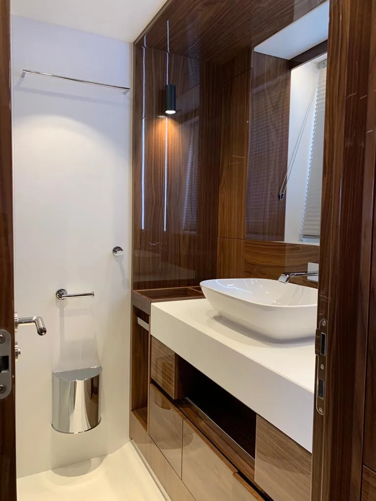 Slide: The Image of Luxurious bathroom in 2020 Sunseeker Manhattan 68 yacht with modern fixtures and wood accents. - 33