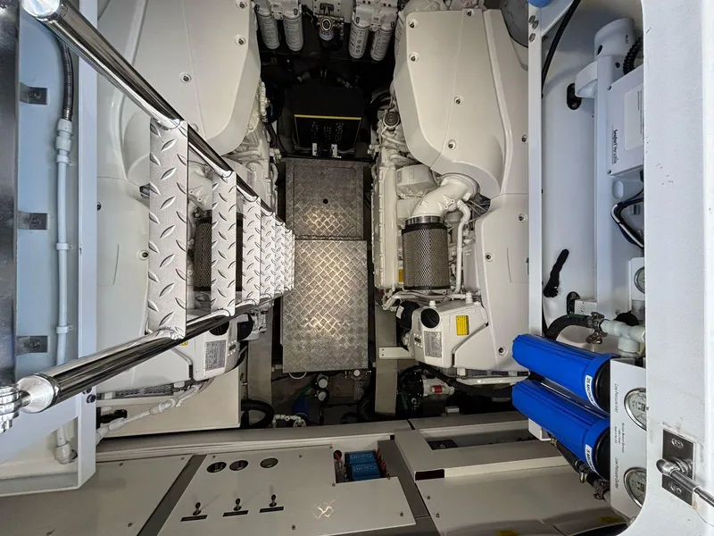 Slide: The Image of Engine room of 2020 Sunseeker Manhattan 68 yacht, featuring dual engines and metallic flooring. - 37