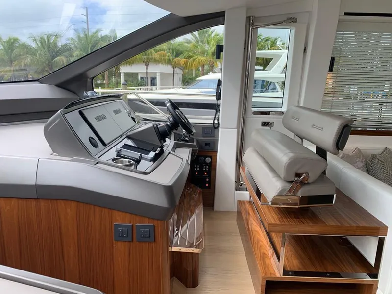 Slide: The Image of Interior of 2020 Sunseeker Manhattan 68 yacht, featuring modern helm and seating. - 9