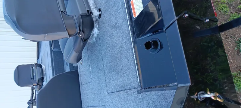 Slide: The Image of 2025 Tracker Pro Team 195 Tournament Edition boat interior with seating and carpeted deck. - 13