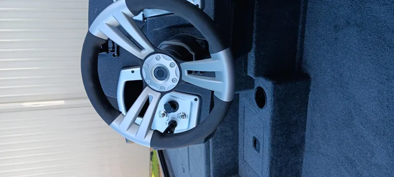 Slide: The Image of Steering wheel of 2025 Tracker Pro Team 195 Tournament Edition boat. - 15