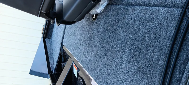 Slide: The Image of 2025 Tracker Pro Team 195 Tournament Edition boat interior with gray carpet and seating. - 5