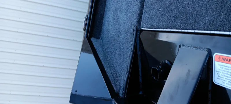 Slide: The Image of 2025 Tracker Pro Team 195 Tournament Edition boat detail, featuring sleek black finish and textured surface. - 8