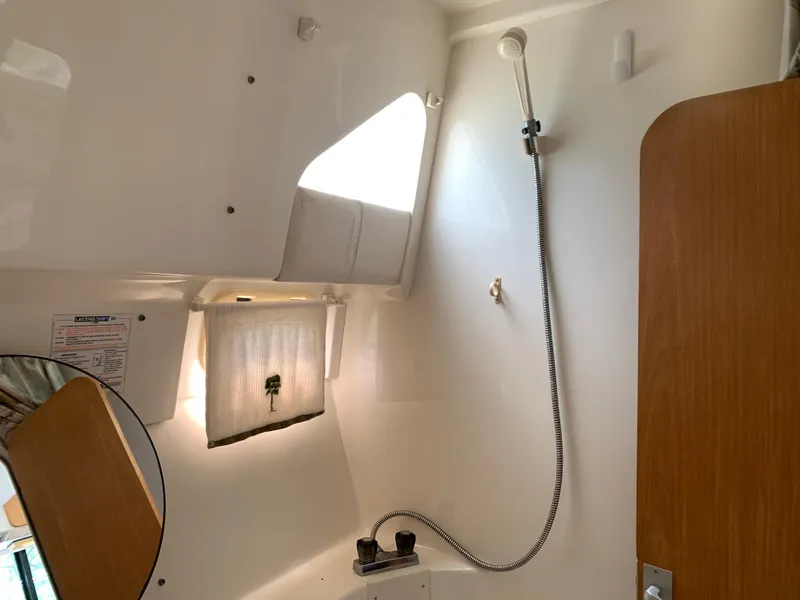 Slide: The Image of Interior of 1994 Mainship 31 Sedan Bridge boat shower area with fixtures. - 21