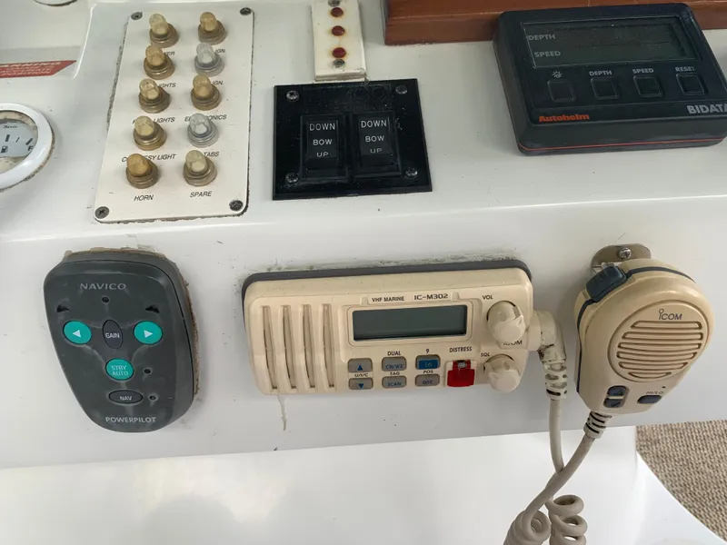 Slide: The Image of 1994 Mainship 31 Sedan Bridge control panel with navigation and communication equipment. - 35