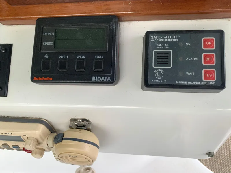Slide: The Image of Control panel of a 1994 Mainship 31 Sedan Bridge with depth, speed, and gas detector. - 36