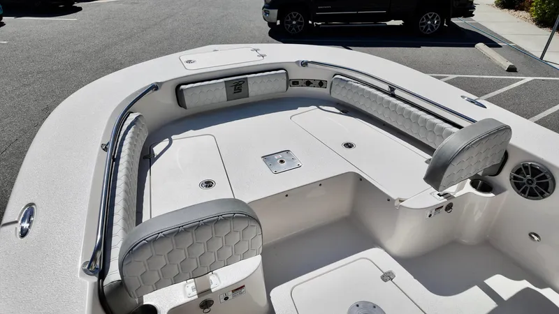 Slide: The Image of 2025 Carolina Skiff 24 Ultra Elite boat interior with cushioned seating and storage compartments. - 17