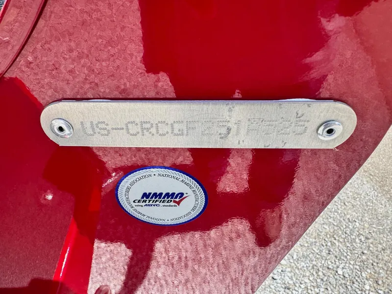 Slide: The Image of Red 2025 Crestliner 1750 Hawk boat with identification plate and NMMA certification sticker. - 4