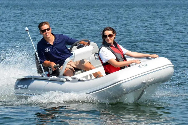 Slide: The Image of 2025 Gala A390HQ boat seat with protective wrap and wooden accents. - 3