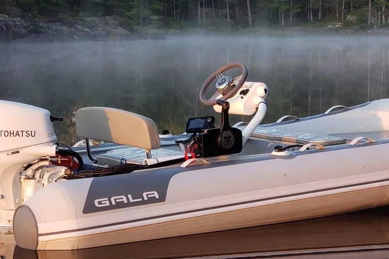 Slide: The Image of Gala A390HQ 2025 boat with Tohatsu engine on misty lake background. - 9