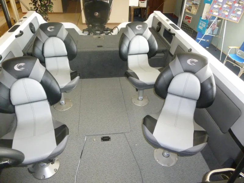 Slide: The Image of 2024 Crestliner 1850 SPORT FISH boat interior with four gray and black seats. - 3
