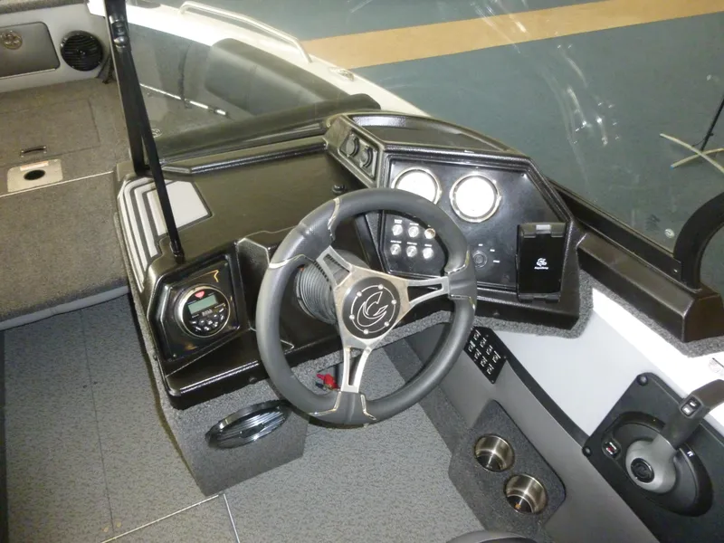 Slide: The Image of 2024 Crestliner 1850 SPORT FISH dashboard with steering wheel and control panel. - 6