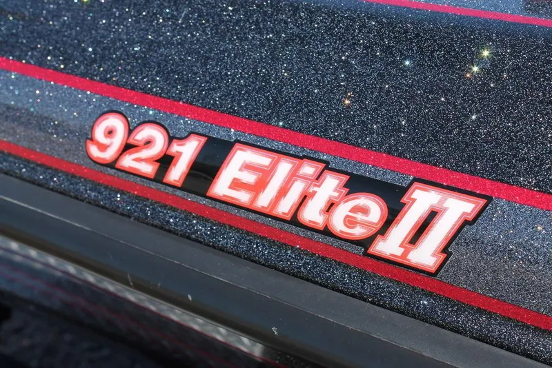 Slide: The Image of Close-up of 2023 Phoenix 921 Elite II logo with glittery finish and red accents. - 12