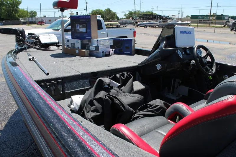 Slide: The Image of 2023 Phoenix 921 Elite II boat interior with Lowrance electronics and fishing gear. - 15