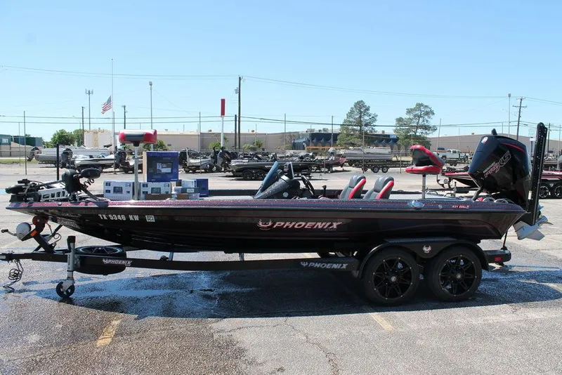 Slide: The Image of 2023 Phoenix 921 Elite II bass boat on trailer in parking lot. - 6