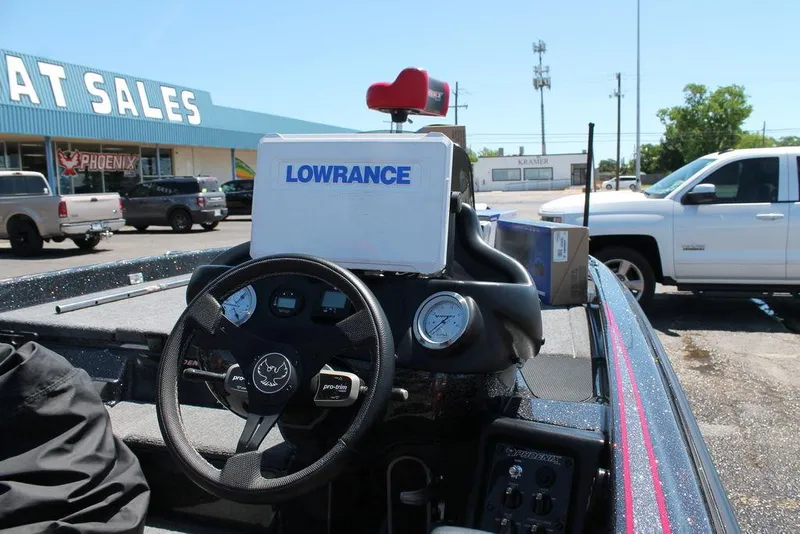 Slide: The Image of 2023 Phoenix 921 Elite II boat dashboard with Lowrance system at dealership. - 9