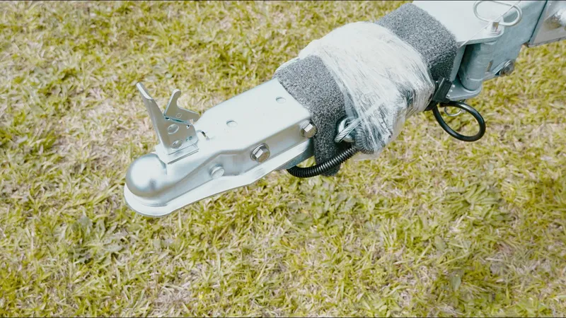 Slide: The Image of Trailer hitch of G3 Guide V187 T 2025 on grass. - 4