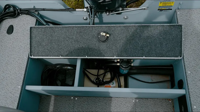 Slide: The Image of Interior view of 2025 G3 Guide V187 T boat showing storage compartments and equipment. - 6